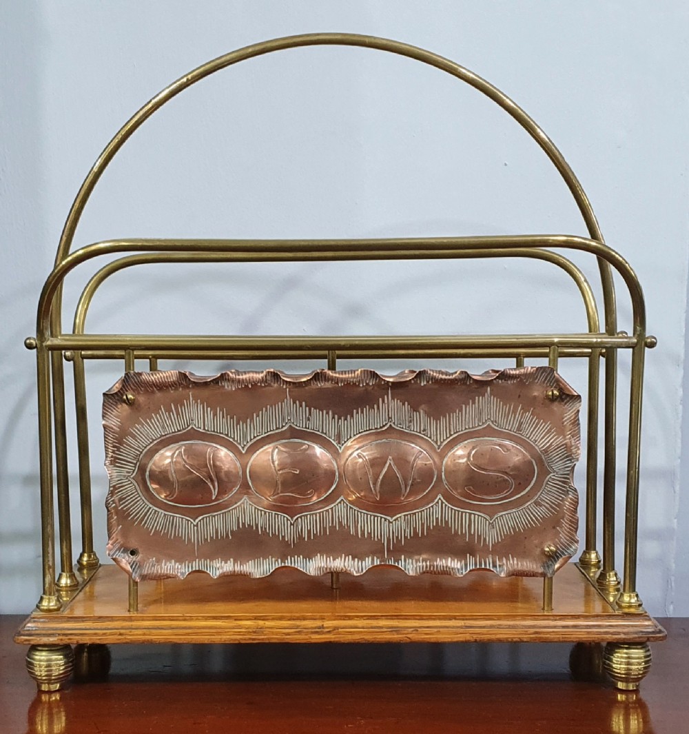 arts and crafts copper brass and oak newspaper rack c1910